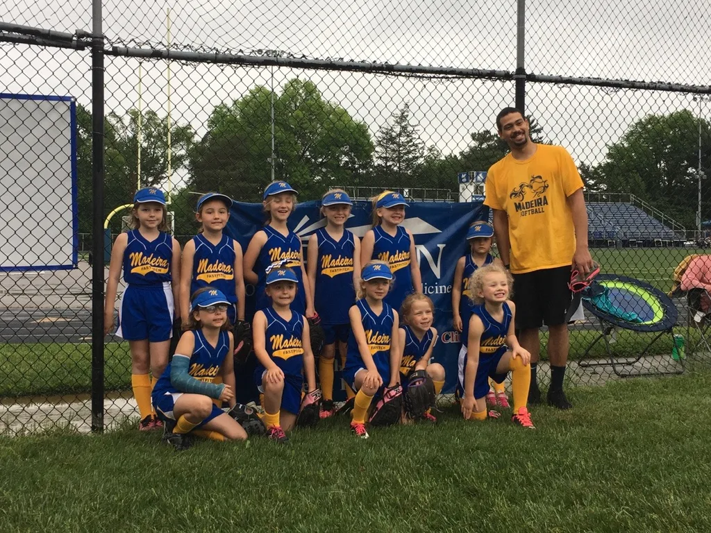 This team was excited about playing the final softball game of the season in the rain.