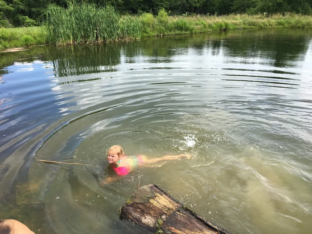 The girls swam in water other than a swimming pool for the first time today at Stella and Ruby’s house, and they loved it! Gwen was unsure of the muddy bottom, but she did finally jump in with everyone else. Josie freaked out when the dogs or goats got too close, but didn’t blink an eye at swimming with frogs and turtles. Abby is part farm girl. She loved everything!