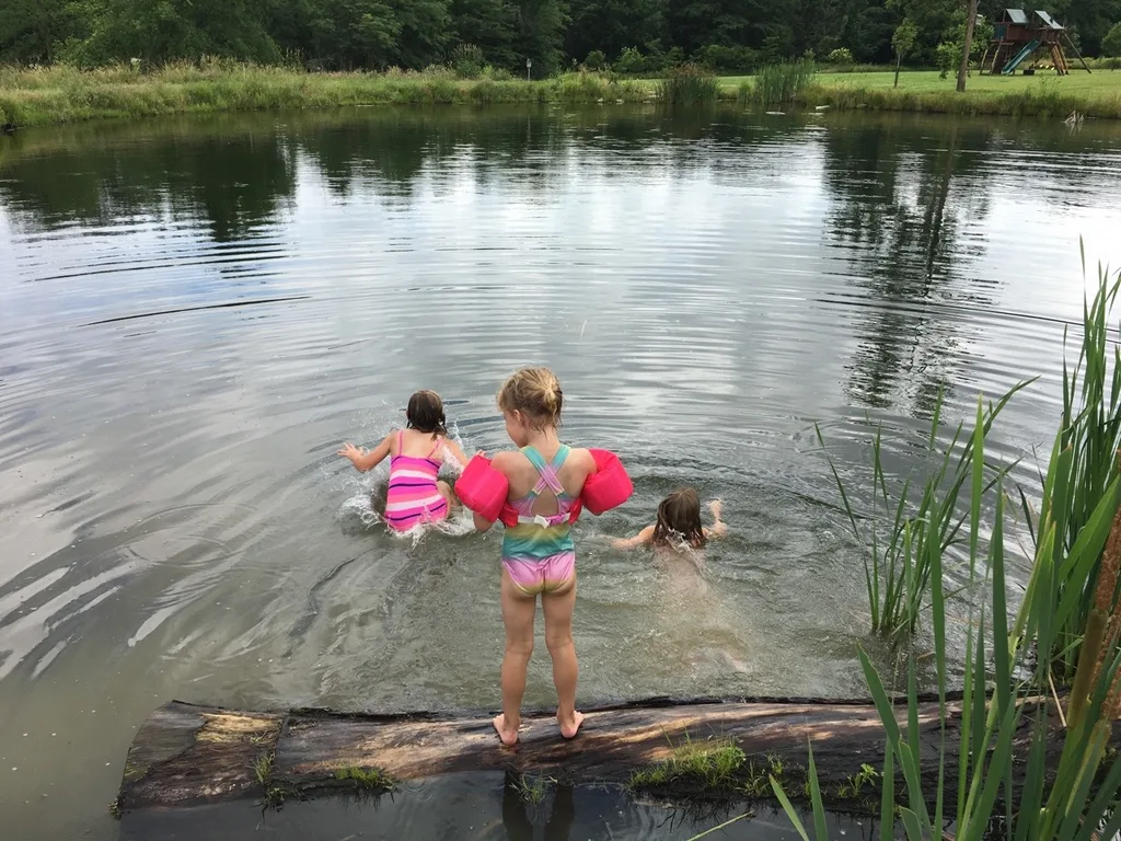 The girls swam in water other than a swimming pool for the first time today at Stella and Ruby’s house, and they loved it! Gwen was unsure of the muddy bottom, but she did finally jump in with everyone else. Josie freaked out when the dogs or goats got too close, but didn’t blink an eye at swimming with frogs and turtles. Abby is part farm girl. She loved everything!
