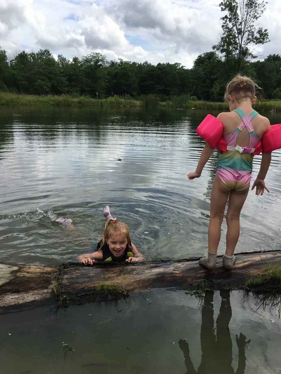 The girls swam in water other than a swimming pool for the first time today at Stella and Ruby’s house, and they loved it! Gwen was unsure of the muddy bottom, but she did finally jump in with everyone else. Josie freaked out when the dogs or goats got too close, but didn’t blink an eye at swimming with frogs and turtles. Abby is part farm girl. She loved everything!