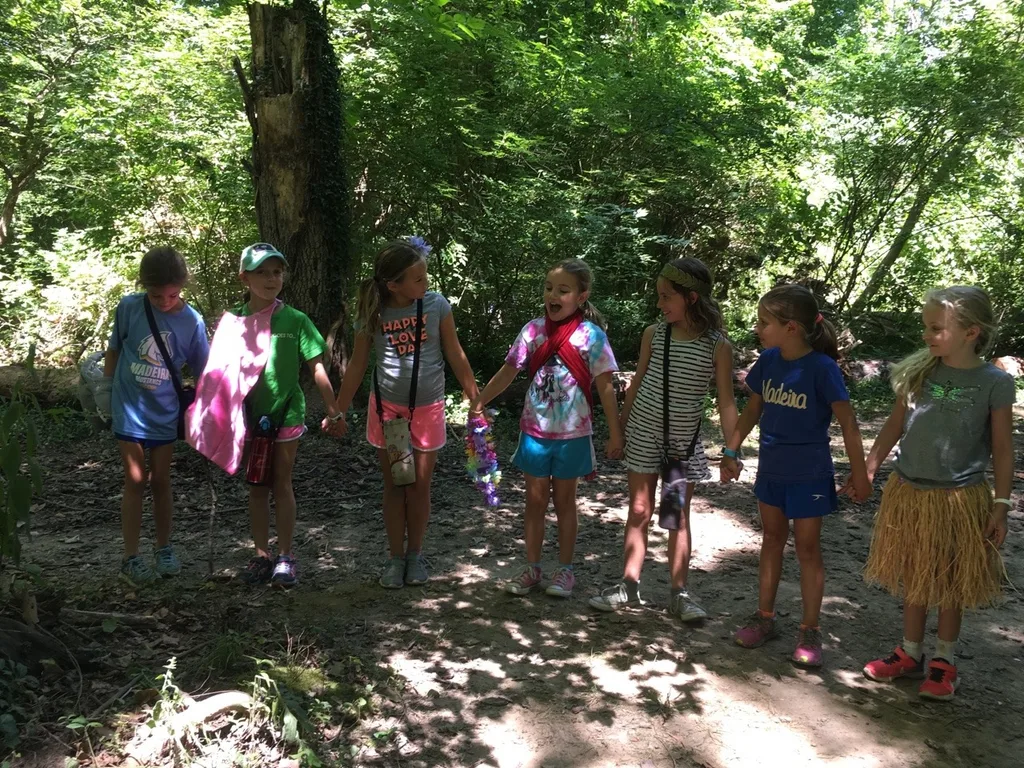 Girl Scout camp day 3 started off with our girls leading the rest of camp in the opening flag ceremony. After that, the day flew by with a talk about graphic design, cards for a service project, a nature scavenger hunt, sun s'mores, a group skit, a spider web craft, singing, creek time, hiking, and more!