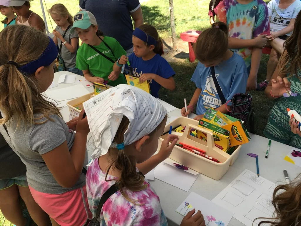 Girl Scout camp day 3 started off with our girls leading the rest of camp in the opening flag ceremony. After that, the day flew by with a talk about graphic design, cards for a service project, a nature scavenger hunt, sun s'mores, a group skit, a spider web craft, singing, creek time, hiking, and more!