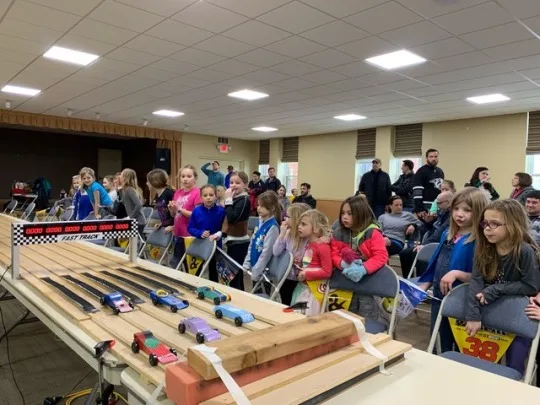 Josie’s sparkly birthday cake racer came in first place in our Daisy race of the 2019 Madeira Scouts Pinewood Derby! Abby’s Ravenclaw racer and Gwen’s rocket were both cool cars, but not quite fast enough to win (6th place).