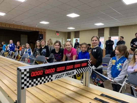 Josie’s sparkly birthday cake racer came in first place in our Daisy race of the 2019 Madeira Scouts Pinewood Derby! Abby’s Ravenclaw racer and Gwen’s rocket were both cool cars, but not quite fast enough to win (6th place).