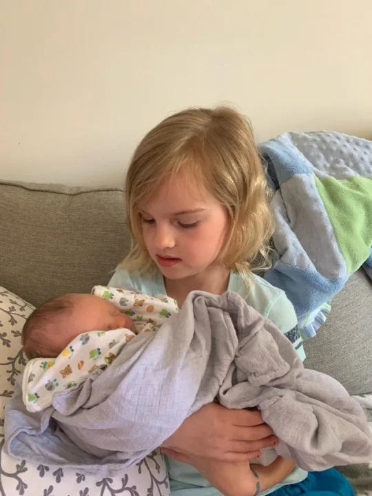 Gwen and Josie loved holding baby Nickolas James.