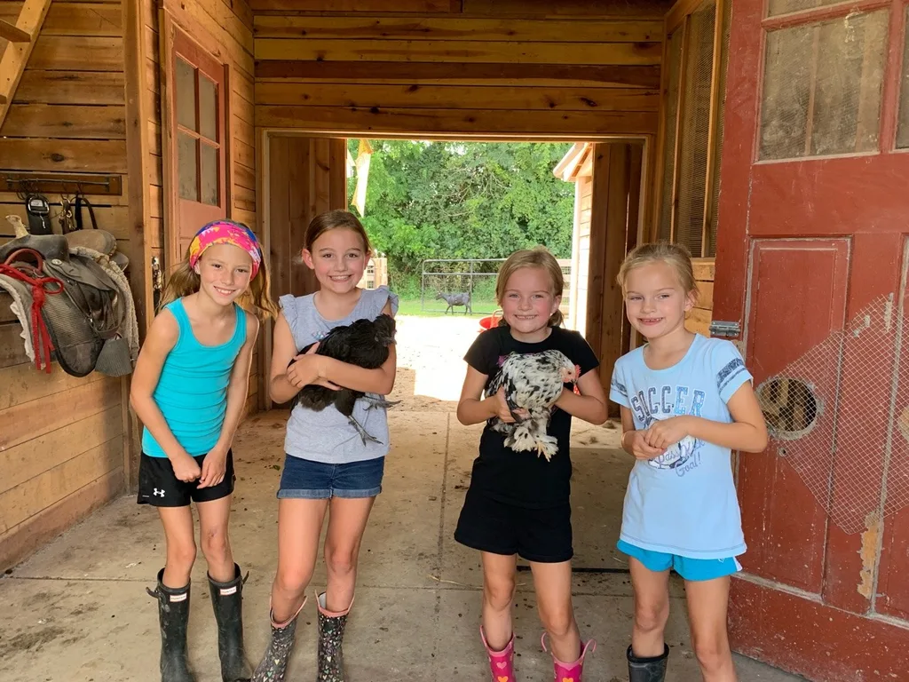 These girls love visiting Stella, Ruby, and their chickens.