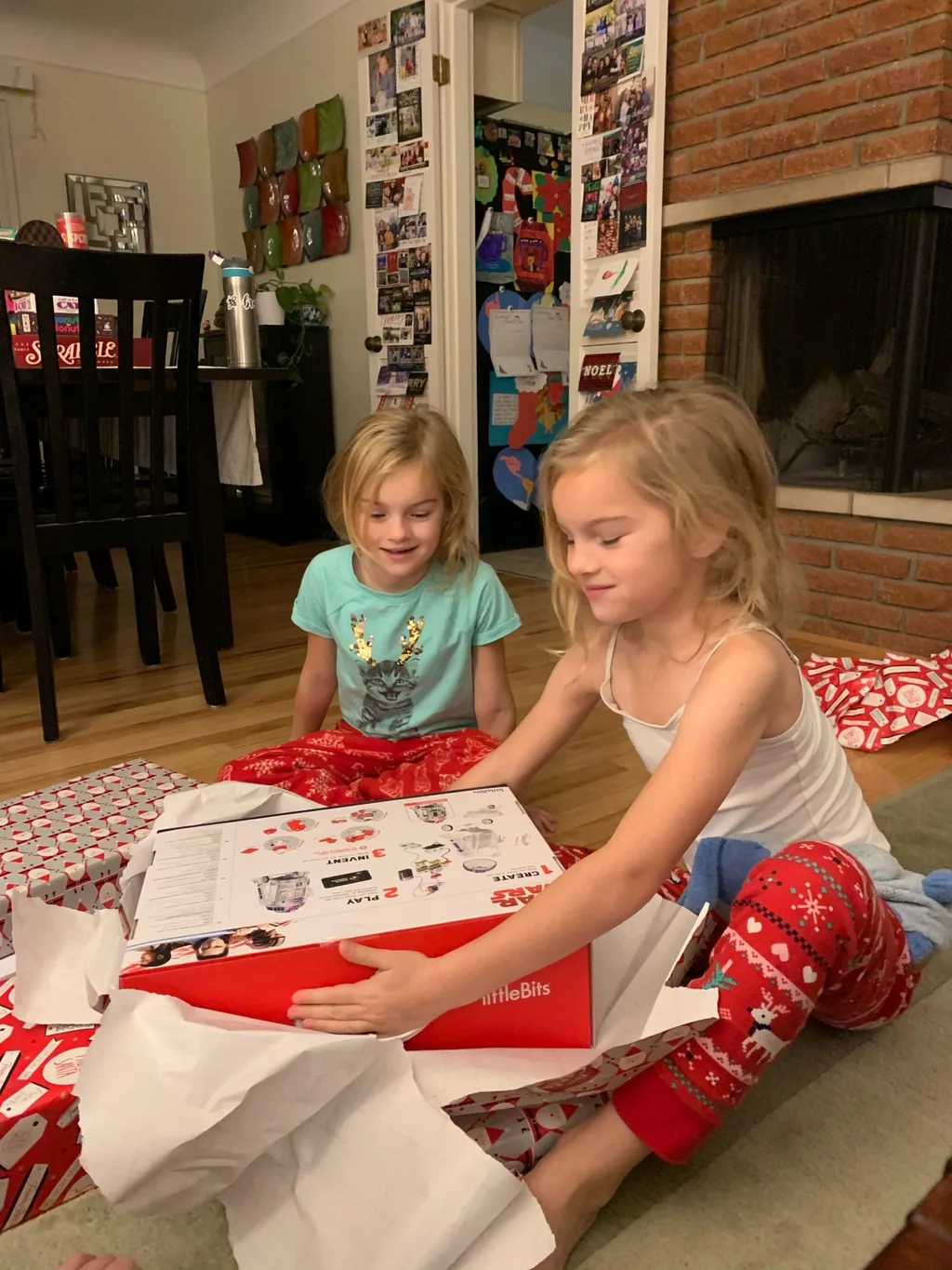 Abby tried to stay up to catch Santa; no luck. Christmas morning featured lots of fun new toys for our maker space.