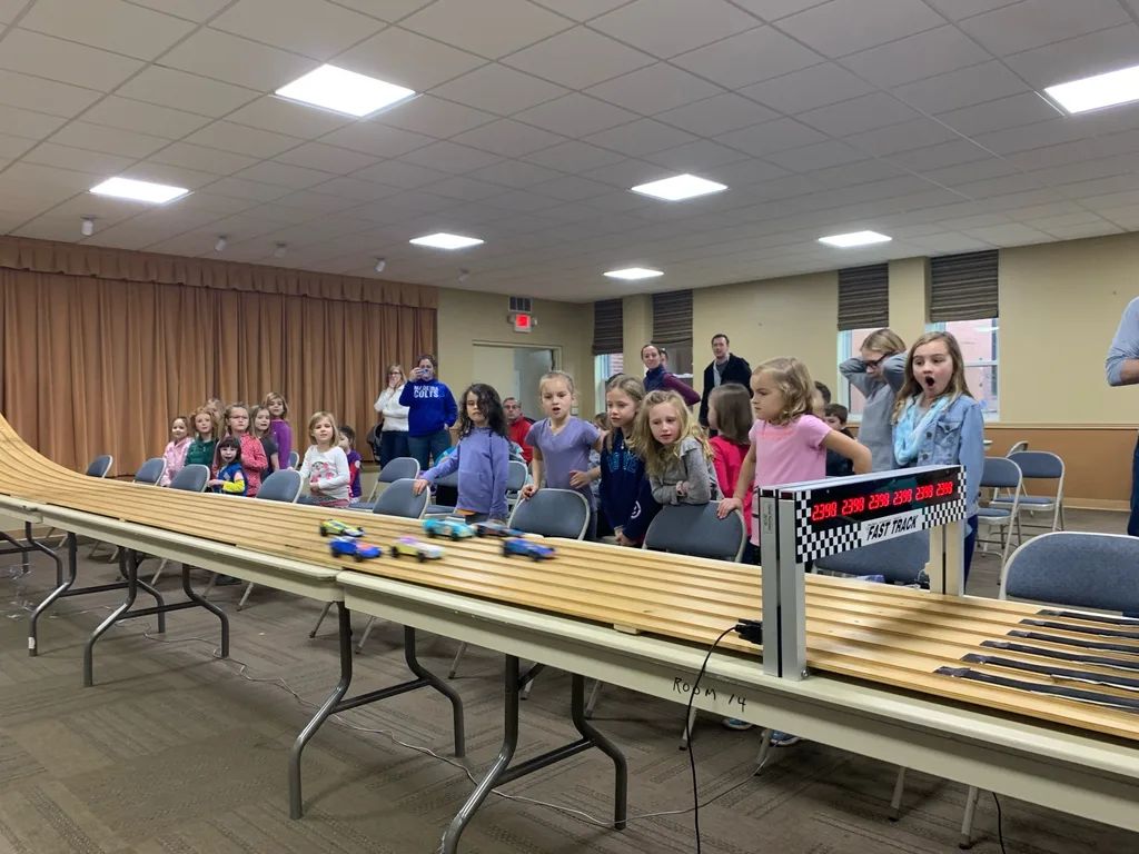 Gwen’s car won first place, and Josie’s car won the “most creative” design medal for their troop. Abby’s car won “most original design” for her troop. And Gwen’s car came in second place in the best of Madeira race for this year’s Madeira Pinewood Derby!