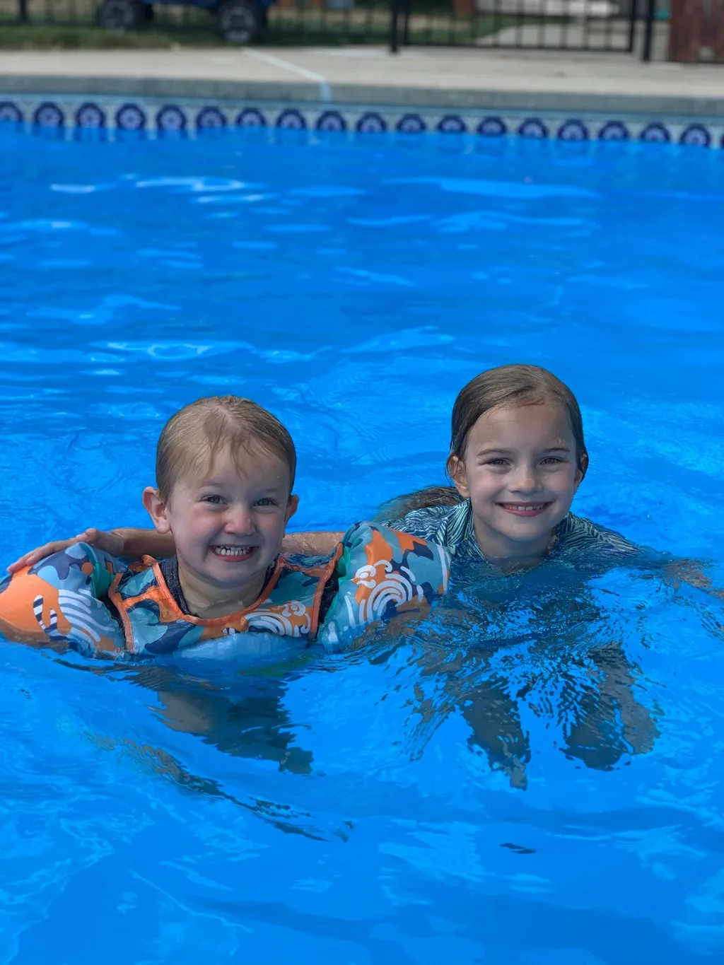 Such a fun day! We all expect a call from Timmy tomorrow to tell us how we never visit (ie he misses us). Gwen and Timmy played, and swam together a ton. Timmy can now jump in the pool from the stairs. Gwen almost convinced him to jump off the diving board. Abby, Gwen, and Timmy giggled their little hearts out while I sprayed them on the trampoline. And little Nicky is a big Abby fan. She did such a good job with him; saw a glimpse of her future as a babysitter.