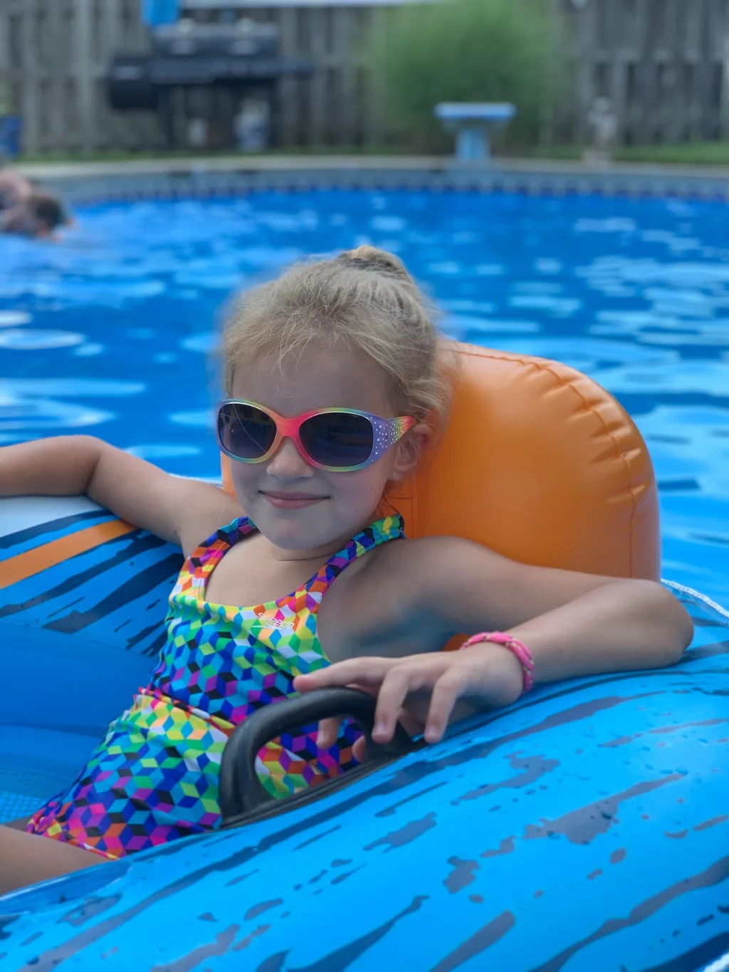 Such a fun day! We all expect a call from Timmy tomorrow to tell us how we never visit (ie he misses us). Gwen and Timmy played, and swam together a ton. Timmy can now jump in the pool from the stairs. Gwen almost convinced him to jump off the diving board. Abby, Gwen, and Timmy giggled their little hearts out while I sprayed them on the trampoline. And little Nicky is a big Abby fan. She did such a good job with him; saw a glimpse of her future as a babysitter.