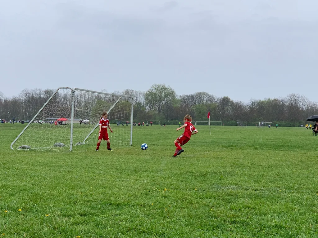 Kolping Memorial Tournament finalists: just for the 2012 players, no subs, rain, and still the girls won their first three games! Lost the final, but still proudly received trophies.