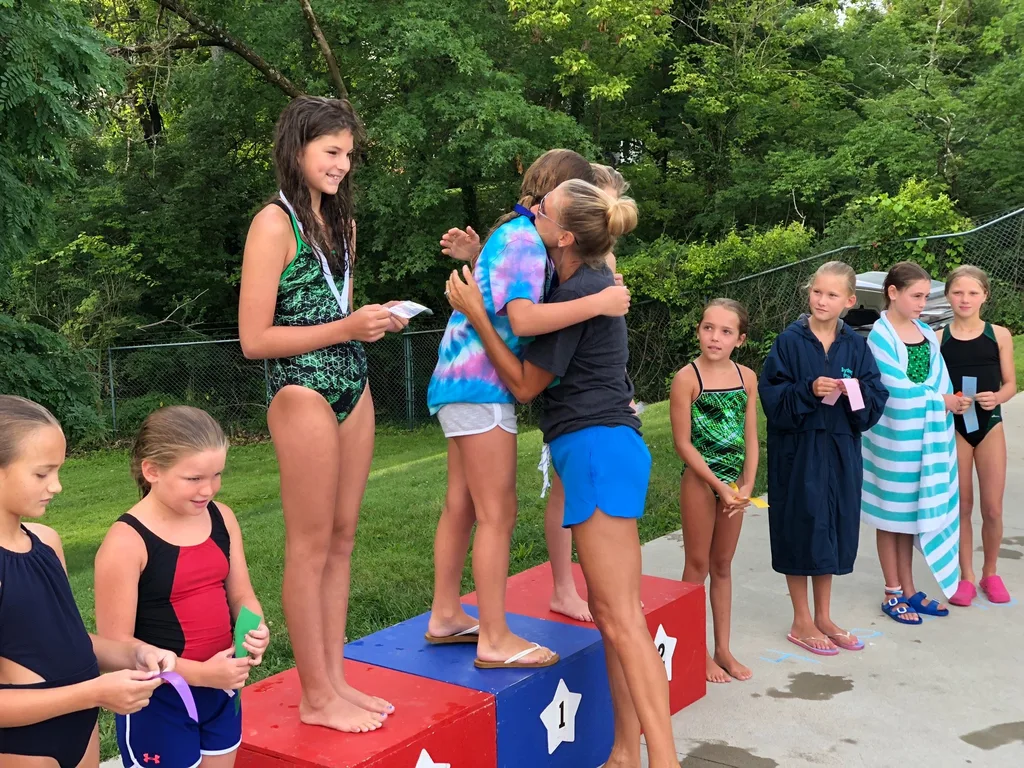 Abby had a great first dive season. She was one of two girls in her age group to represent the swim club in the dive finals against girls from all over the city. All those early morning practices paid off, because she won first place! (Then she raced off to Girl Scout camp.)