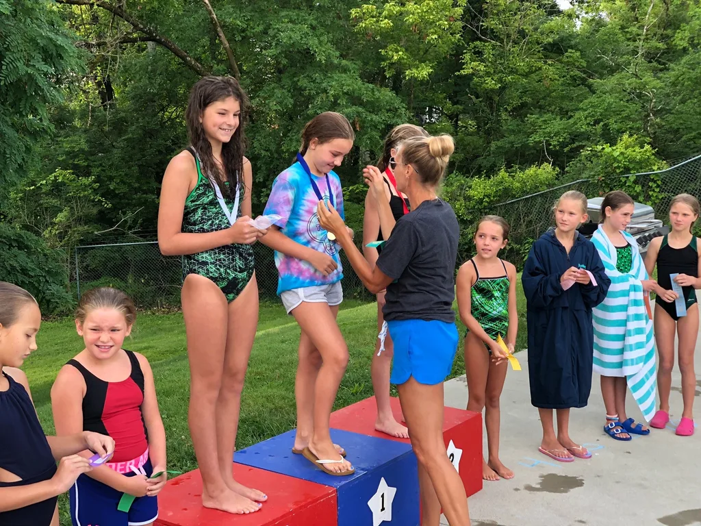 Abby had a great first dive season. She was one of two girls in her age group to represent the swim club in the dive finals against girls from all over the city. All those early morning practices paid off, because she won first place! (Then she raced off to Girl Scout camp.)